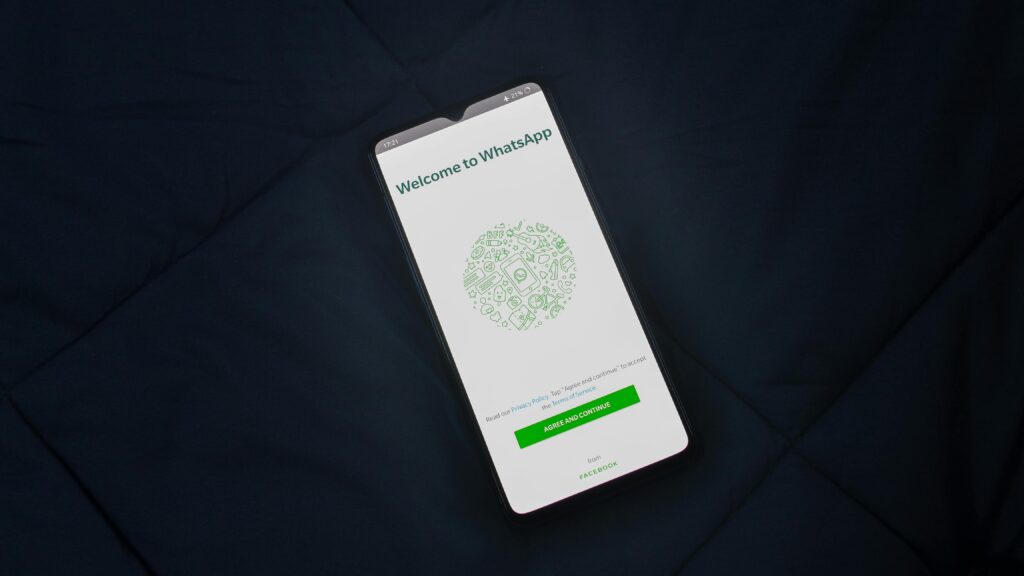 Smartphone displaying WhatsApp welcome screen